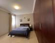 Fully furnished bedroom with comfortable bedding